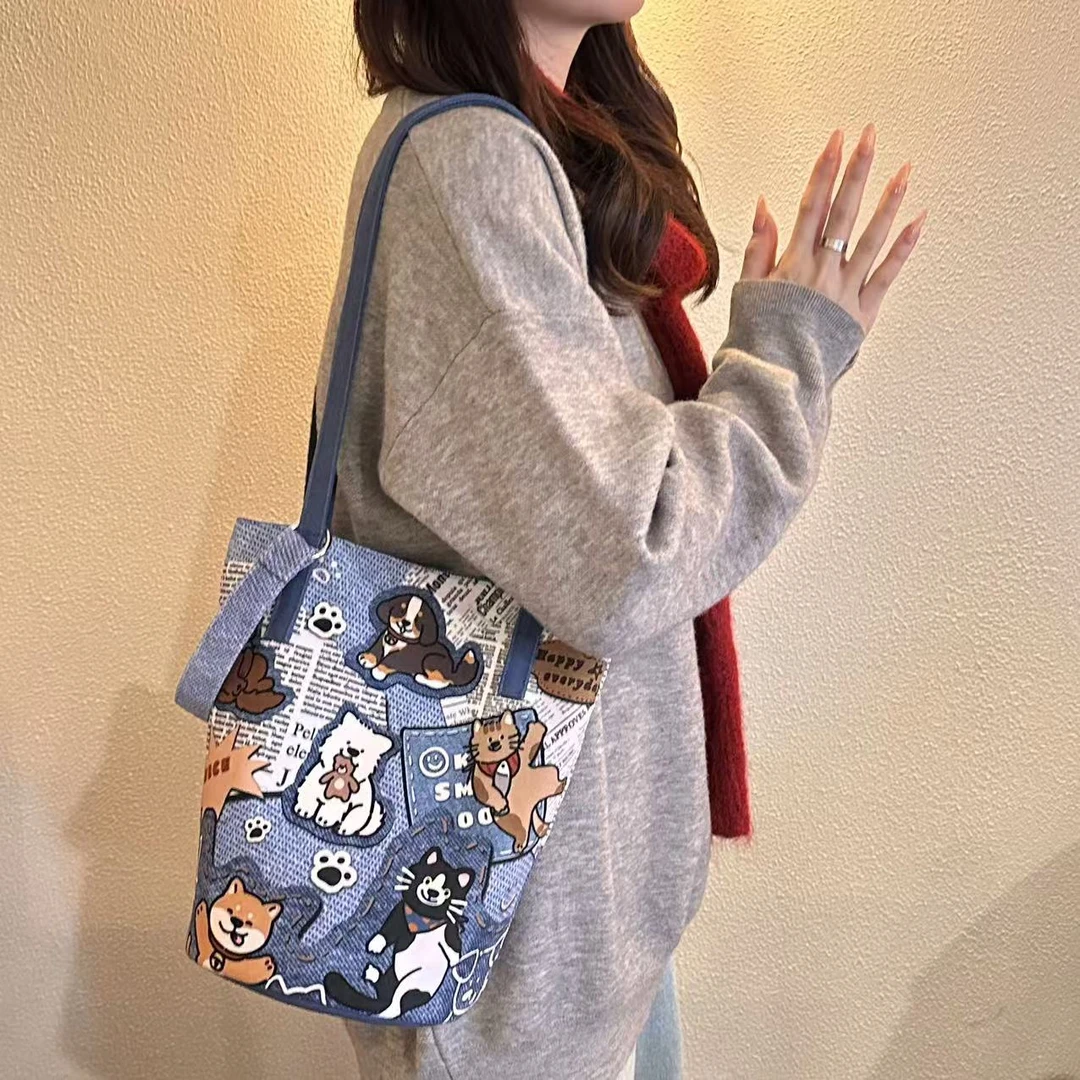 尼睿x小狗的快乐世界 原创新款细肩带水桶包休闲通勤包包女包