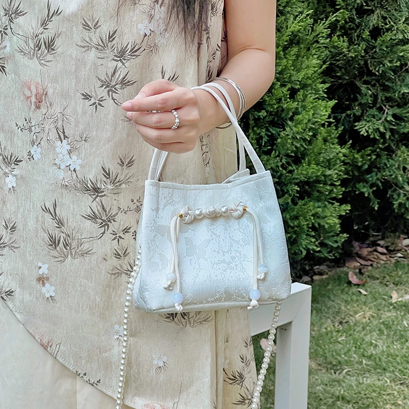 路小船原创工作室白闪蝶小水桶高级感休闲小众女包2024新款斜挎包