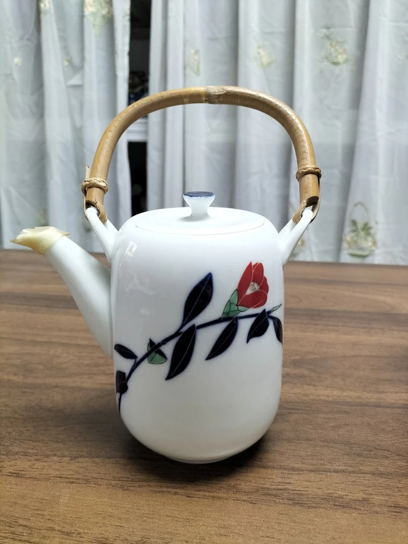 香兰社山陶瓷茶花提梁壶01/32有轻微牛毛痕在壶身，要反光才看的到