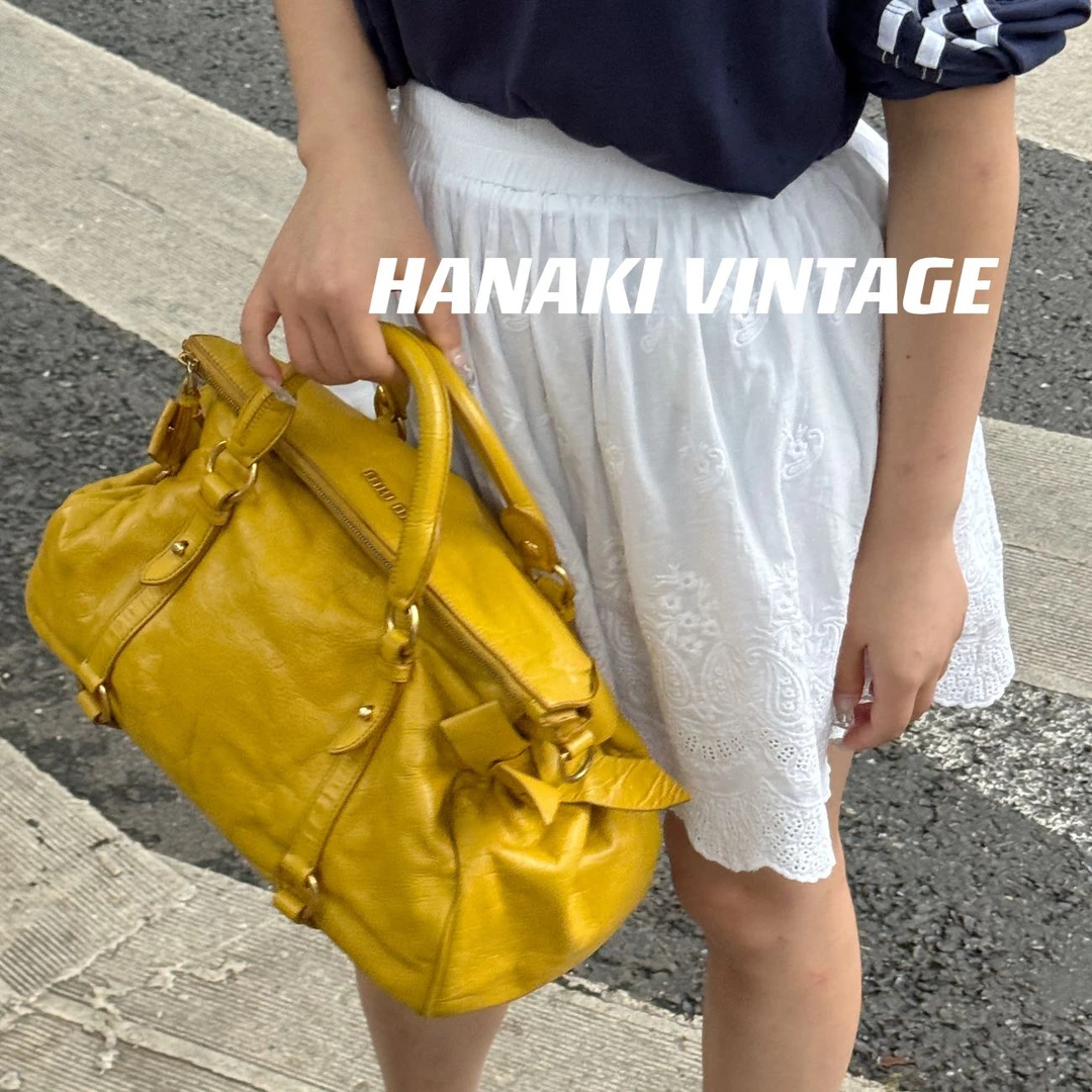 95新 MIU MIU/缪缪 花绮中古/MiuMiu姜黄蝴蝶结机车斜挎包/95新