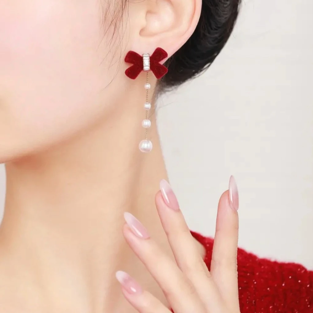 钛钢仿珍珠耳饰 丝绒蝴蝶结流苏耳钉女款轻奢法式复古过年耳环