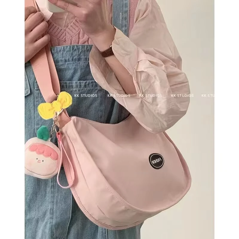 时尚百搭ins斜挎包包女2024新款潮春夏甜美饺子包小众粉色帆布包