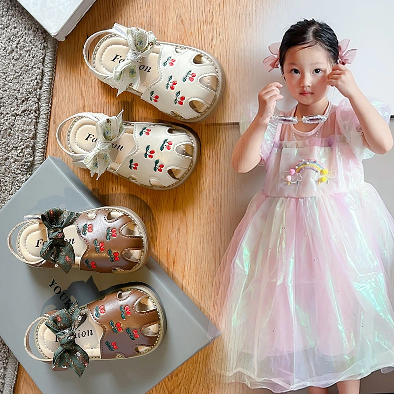 小女孩蝴蝶结包头凉鞋2024夏季款宝宝镂空凉鞋小童时尚公主凉鞋