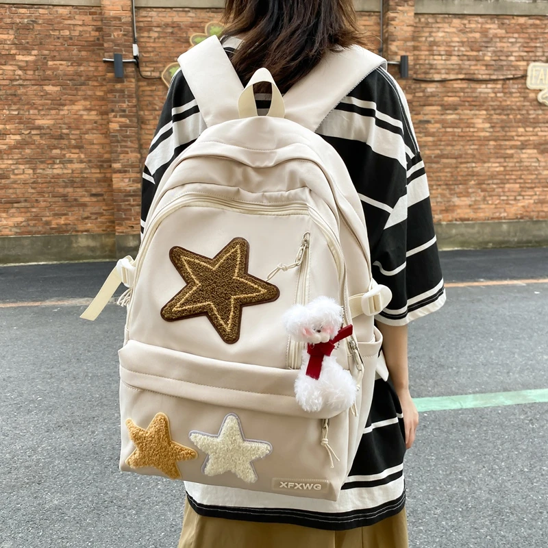 校园小众帆布星星书包女辣妹撞色日系可爱初高中学生大容量双肩包