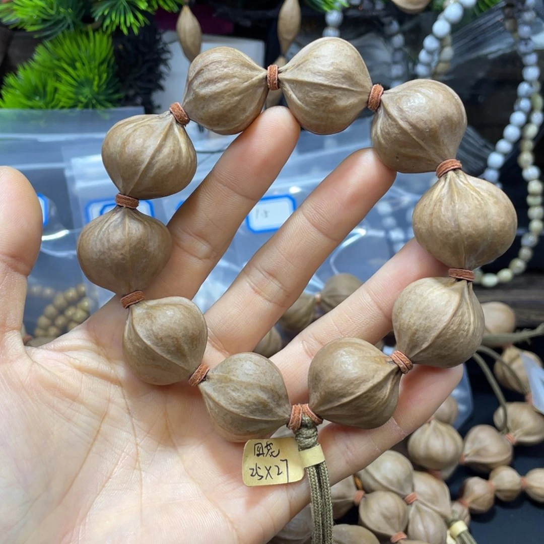 逍***客吊坠橄榄核2527四花铁核