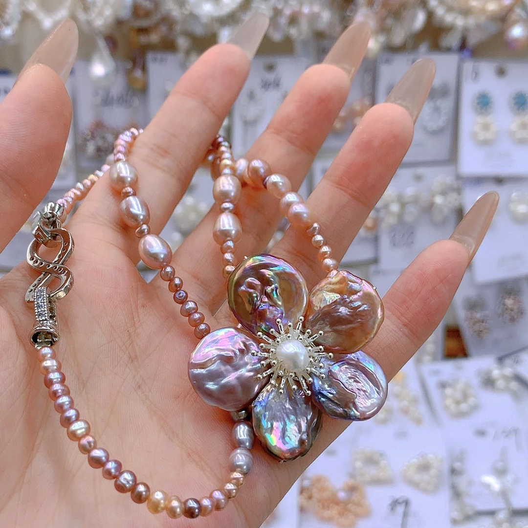 银S925镶嵌淡水珍珠耳饰智****y