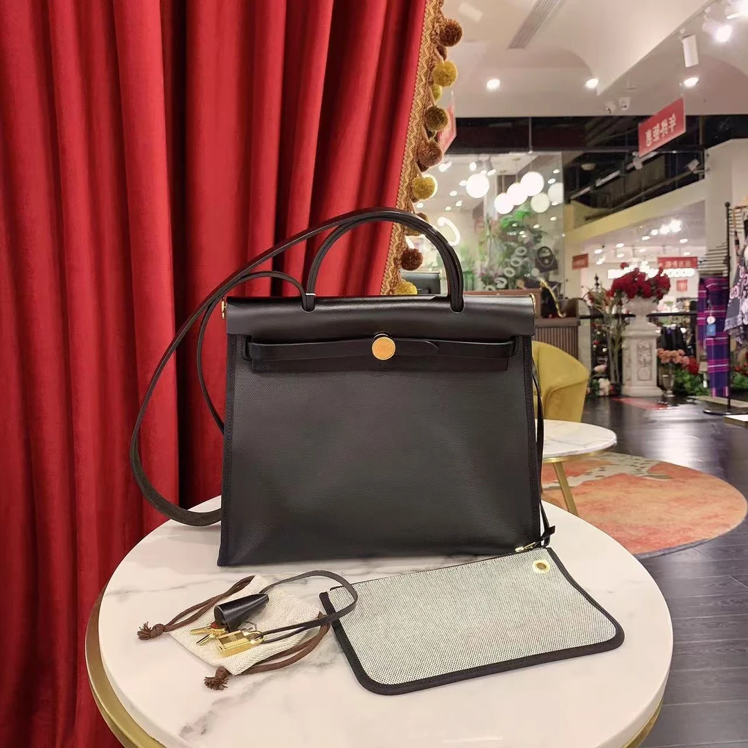 95新 Hermes/爱马仕 herbag31黑色金扣防水布单肩包/69937899