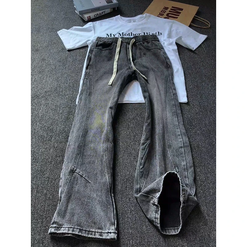 解构拼接牛仔裤男款潮牌cleanfit水洗黑色渐变裤子直筒修身微喇裤