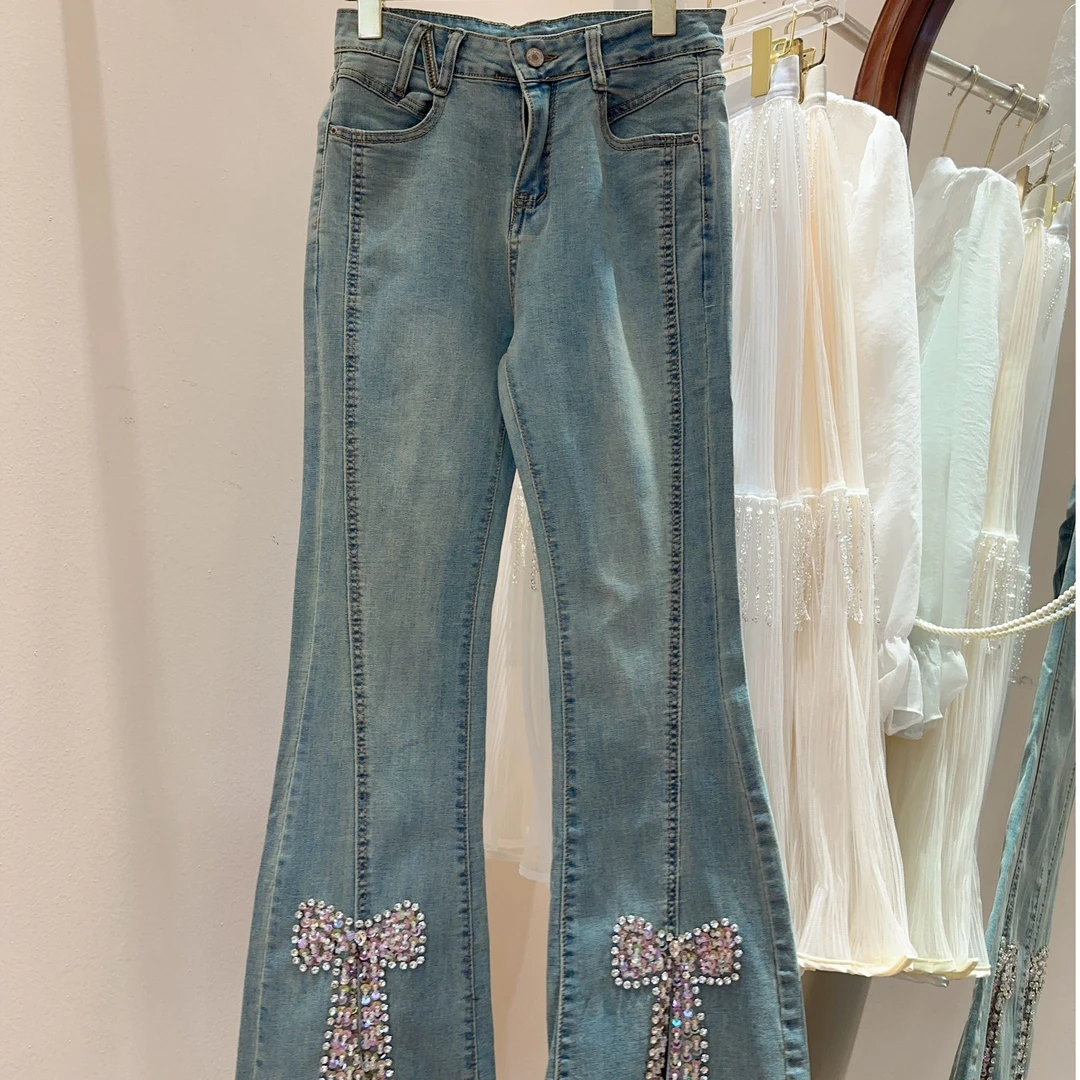 艾日秀法式甜美水钻蝴蝶结修身显瘦牛仔裤长裤 E8711