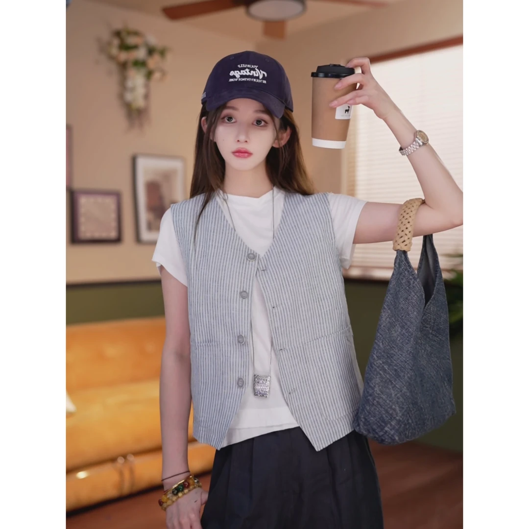 余紫绮.【纸飞花舞】时尚条纹无袖马甲显瘦上衣Z325249