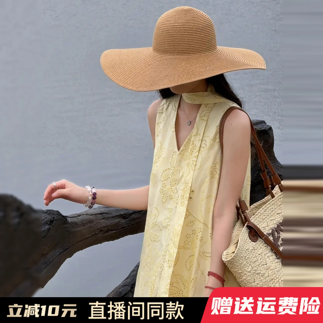 无袖V领设计感印花黄色连衣裙子女2025新款夏气质绝美度假风长裙