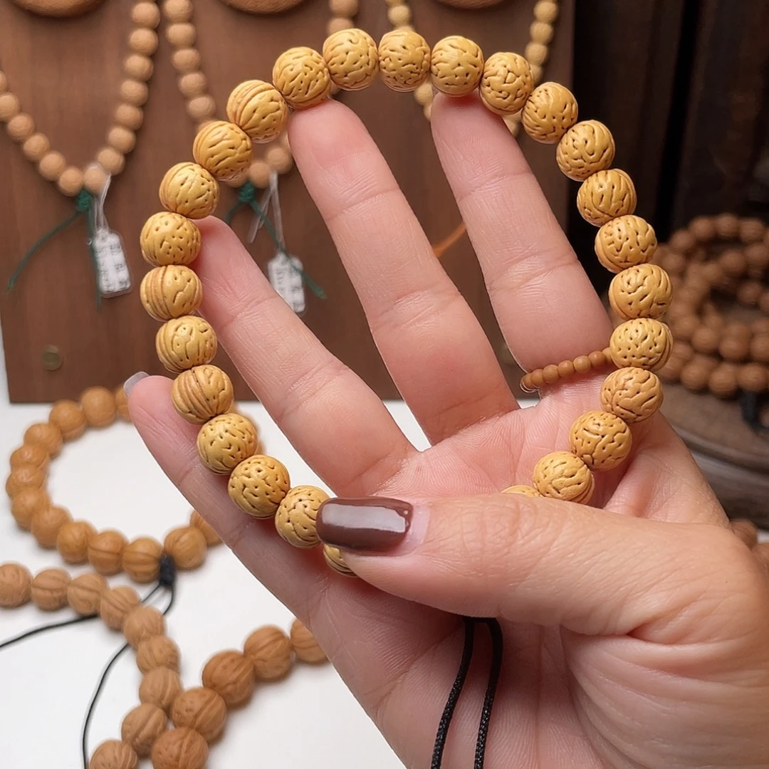 尤***g10加野生小金豆桃核手持