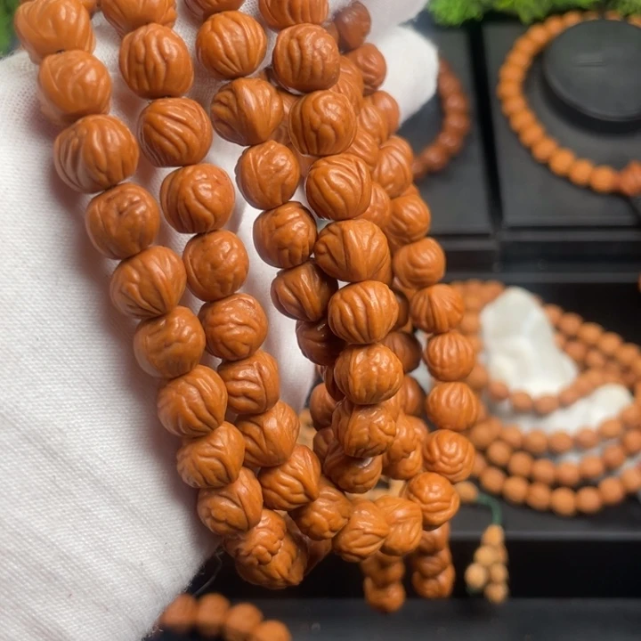 星***奕木质类精品桃核脖挂