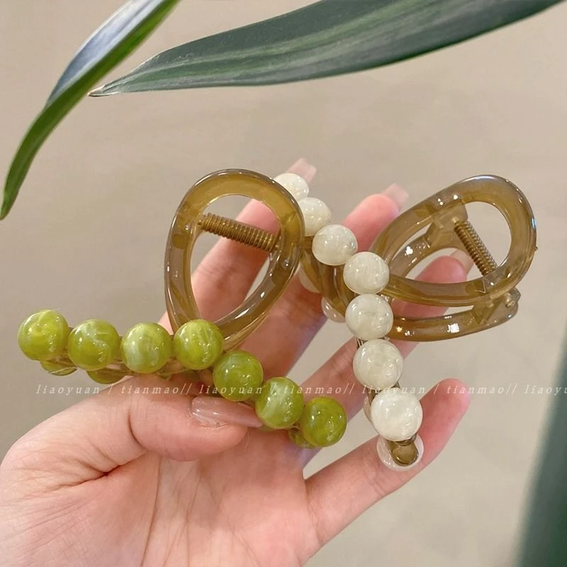 交叉多仿皮发量显锌气质抓夹盘发小众复古风合新款有镀层足豆豆