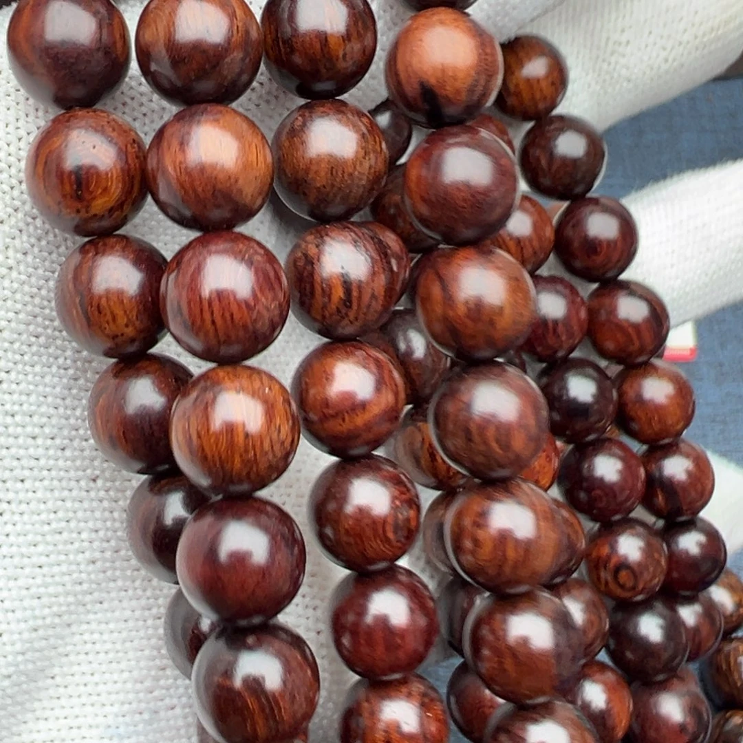 木蝎****0海南红降花梨公1.0圆珠黑金满纹多圈