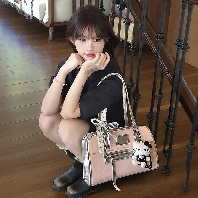 爆款粉色手提保龄球双肩包包女2025新款夏天高级感小众公文单肩包