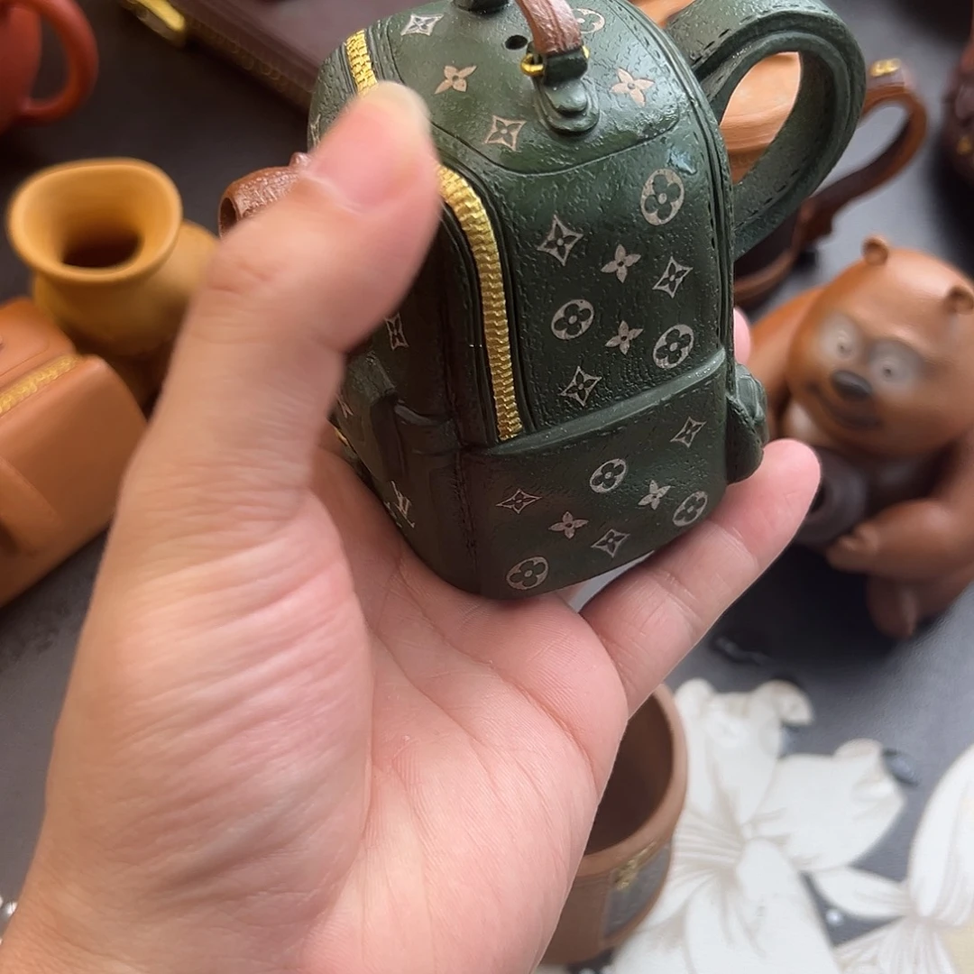 紫砂茶壶背包壶是由他创作制作引进