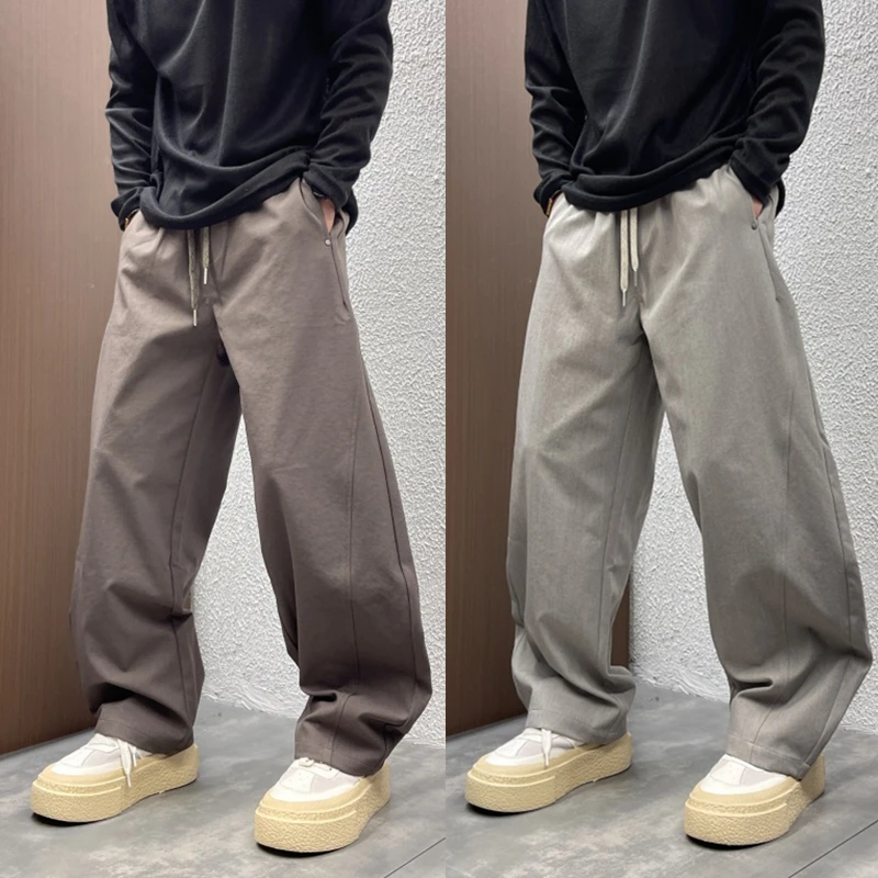 2025秋季速干宽松拼接百搭纯色弯刀裤高街垂感阔腿男士抽绳休闲裤