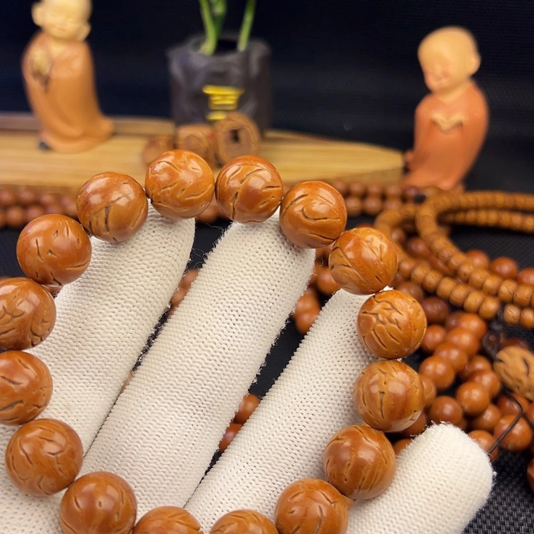 瑞****野生龙纹桃核光珠