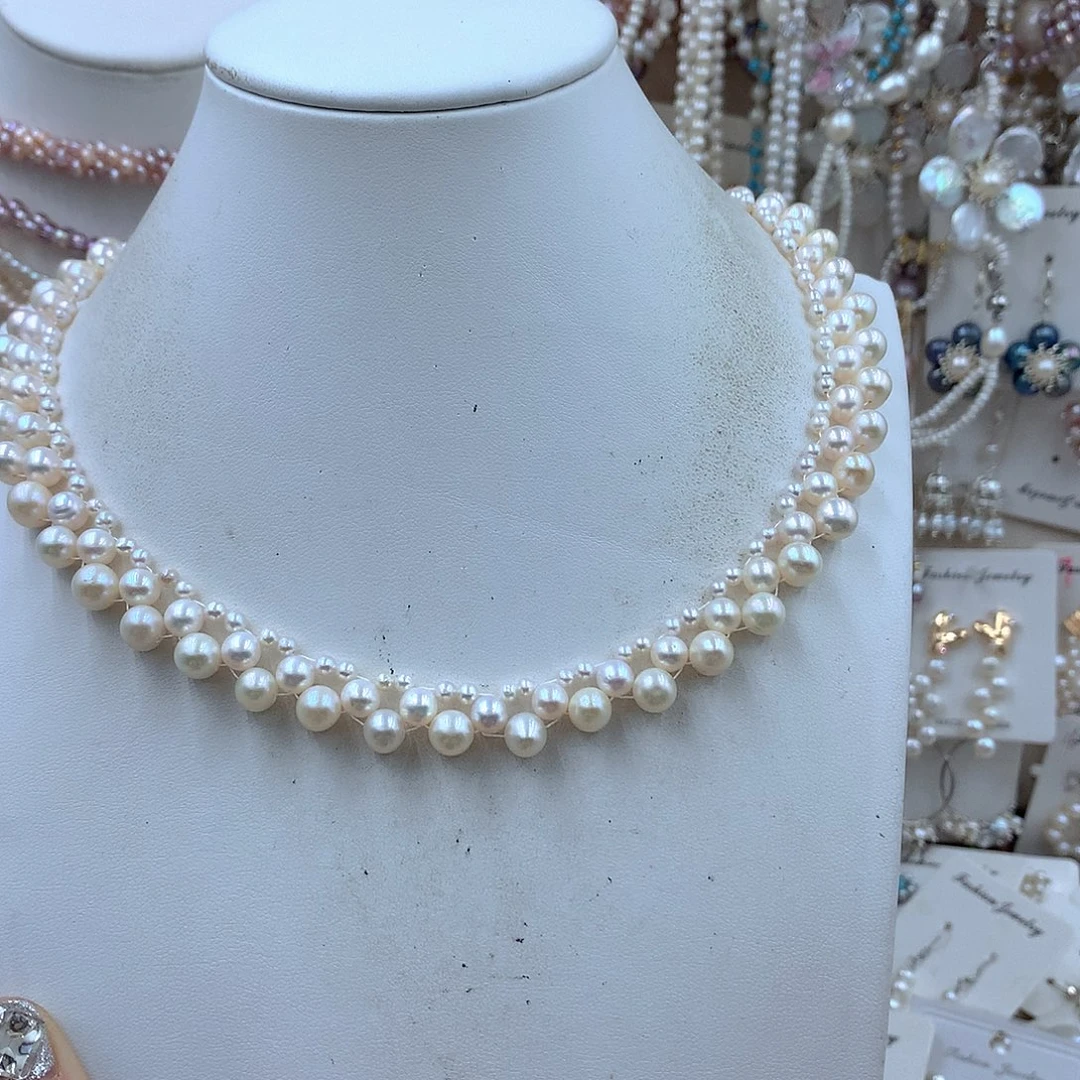 哈***哈淡水珍珠银S925镶嵌耳饰