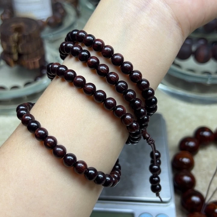 花梨木类海南红降0.6/108颗黑珍珠满油微瑕