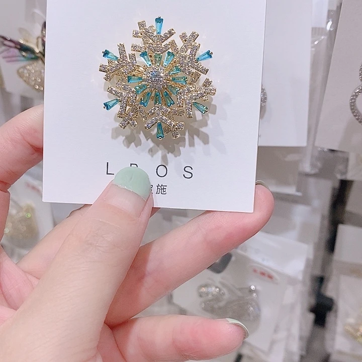 铜合金锆石旋转雪花胸针