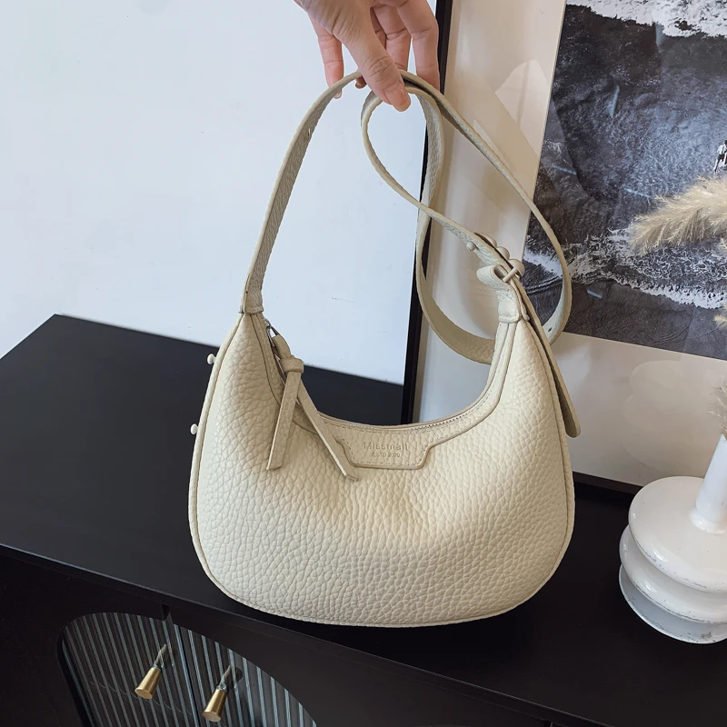 2025春夏新款饺子包通勤风韩版版定型斜挎包小众复古单肩白色简约