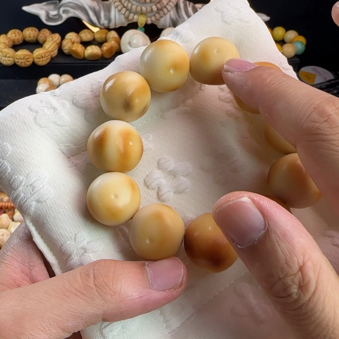 菩提根/象牙果吊坠瑕疵烤色蒜瓣手串一条