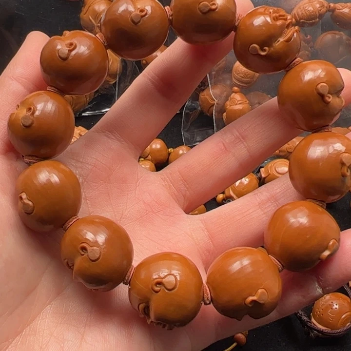 刘***么橄榄核吊坠20百态