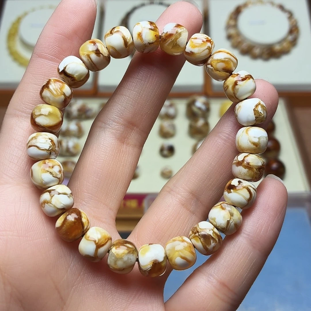 青***藤桃核吊坠沁色老型手串