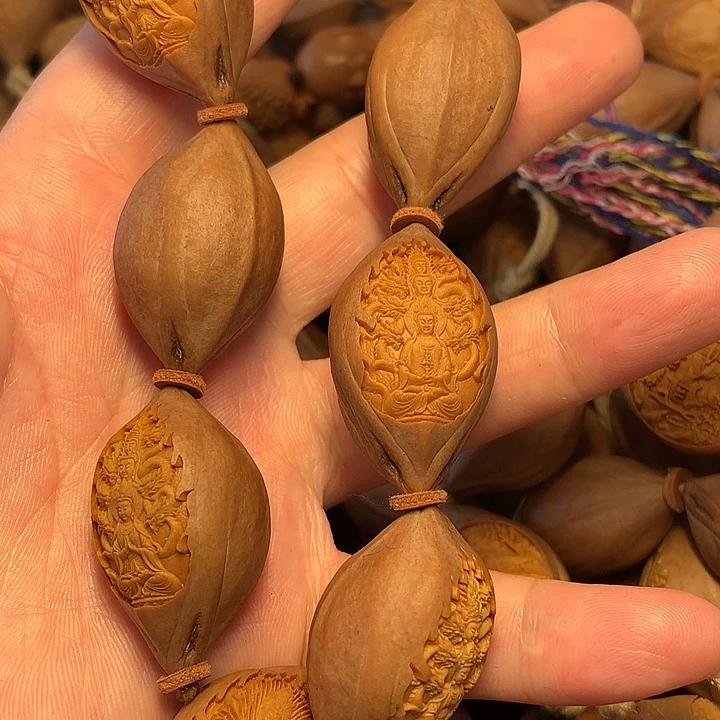 瑕***疵橄榄核雕刻手串万佛