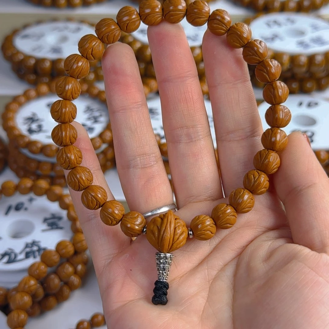 桃核手串一*龙纹桃核原皮元宝手持