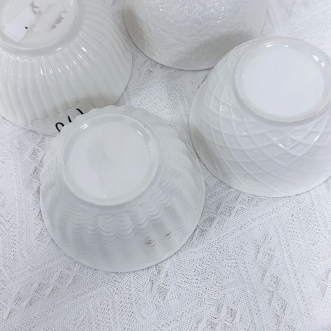 瓷片四个图案各 一。