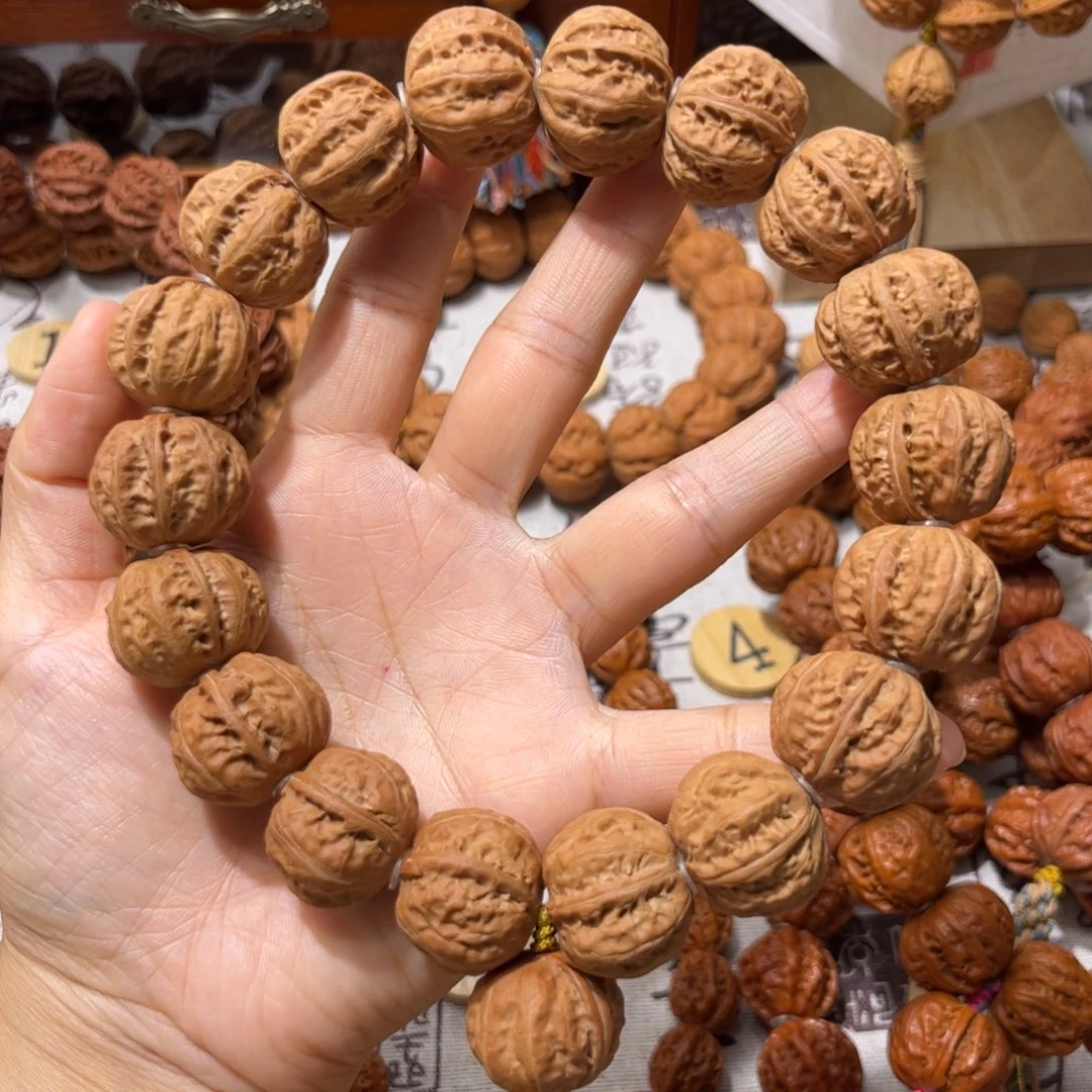 刘***。吊坠桃核原皮磨盘