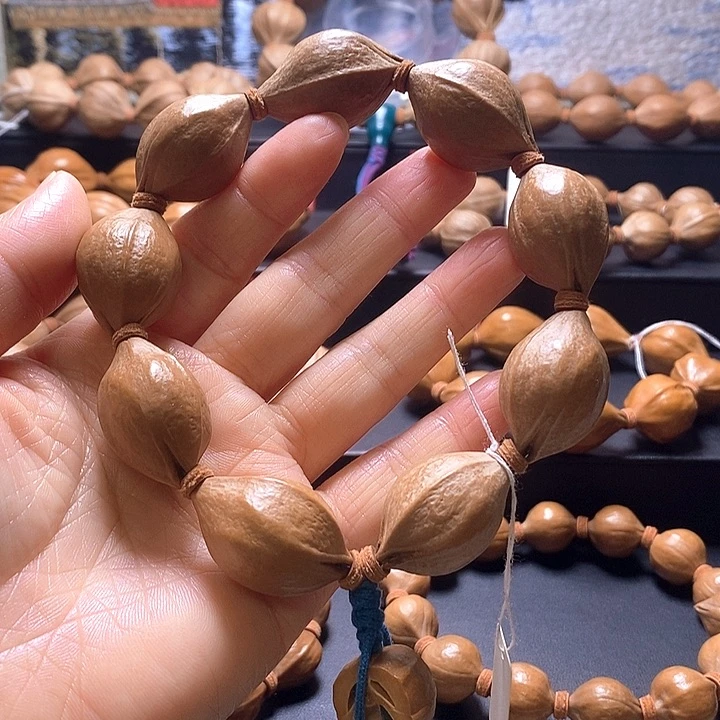 迪***花橄榄核手串三花20×31