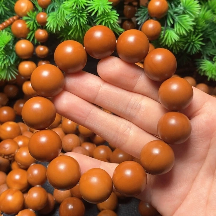 橄榄核手串飘*1.8红料光珠