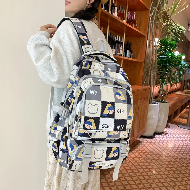 女童趣可爱动漫卡通格纹透气书包ins风欧若智性风