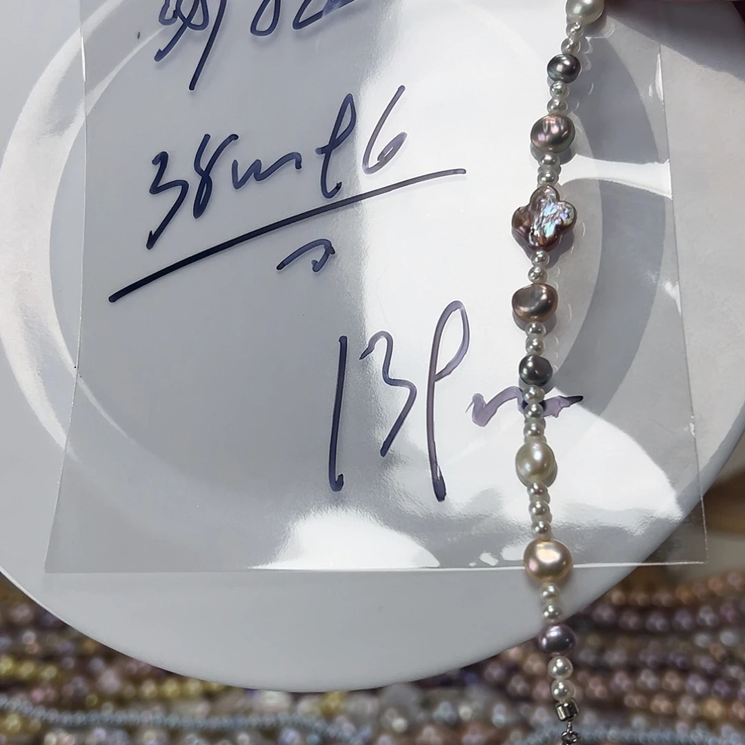 钦***拉手绳淡水珍珠钛钢