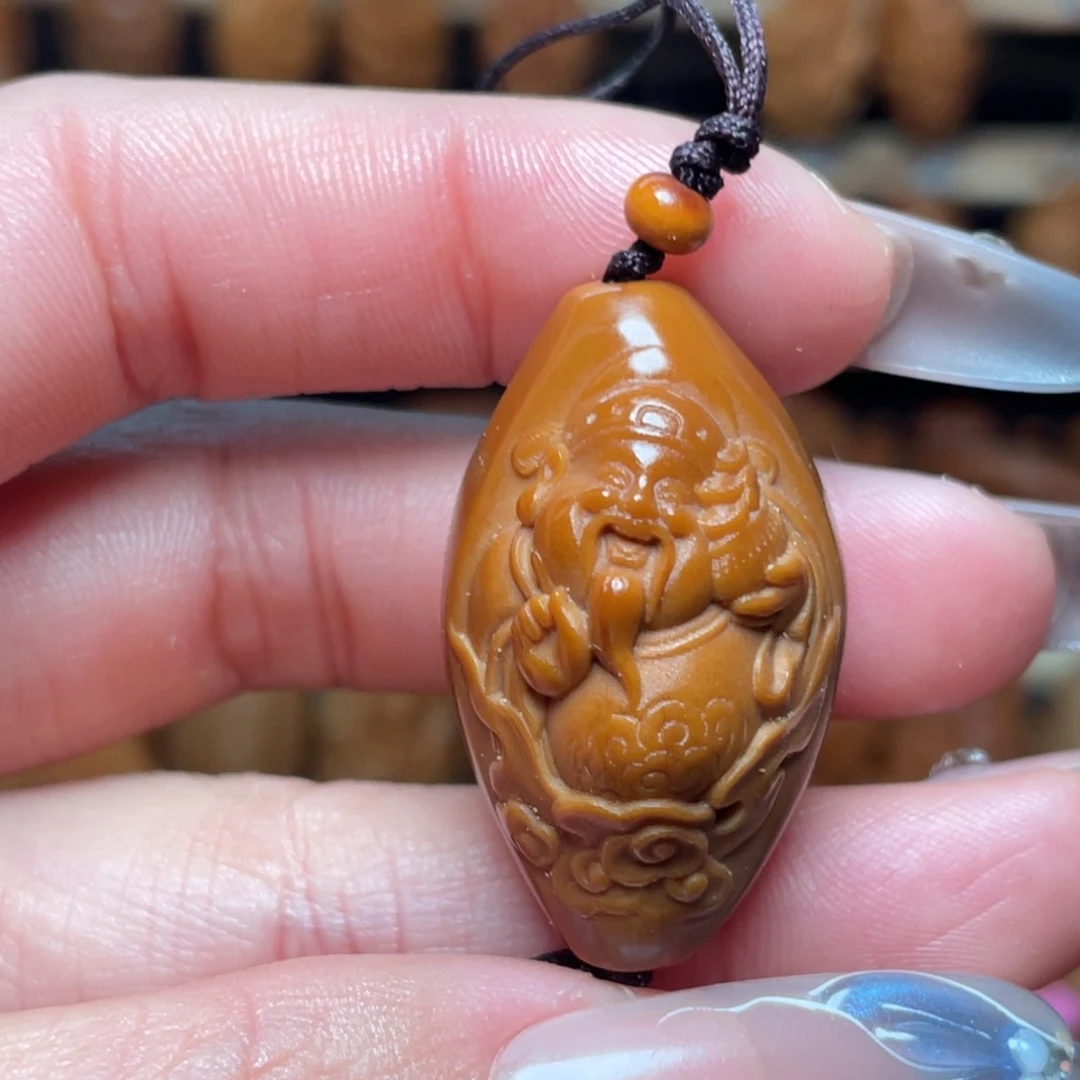 橄榄核把件包衣财神