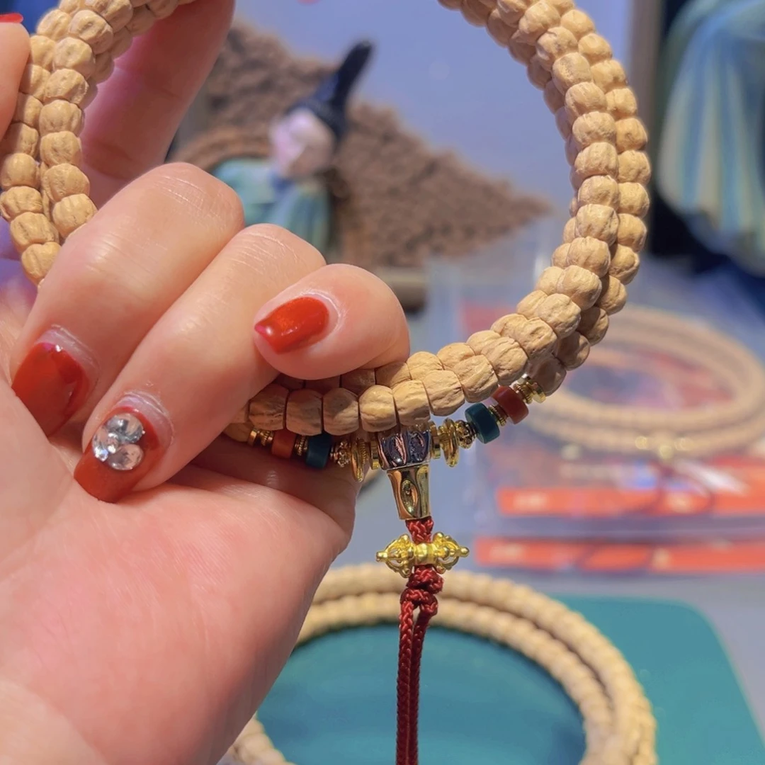 柏香籽/百香籽吊坠小****人