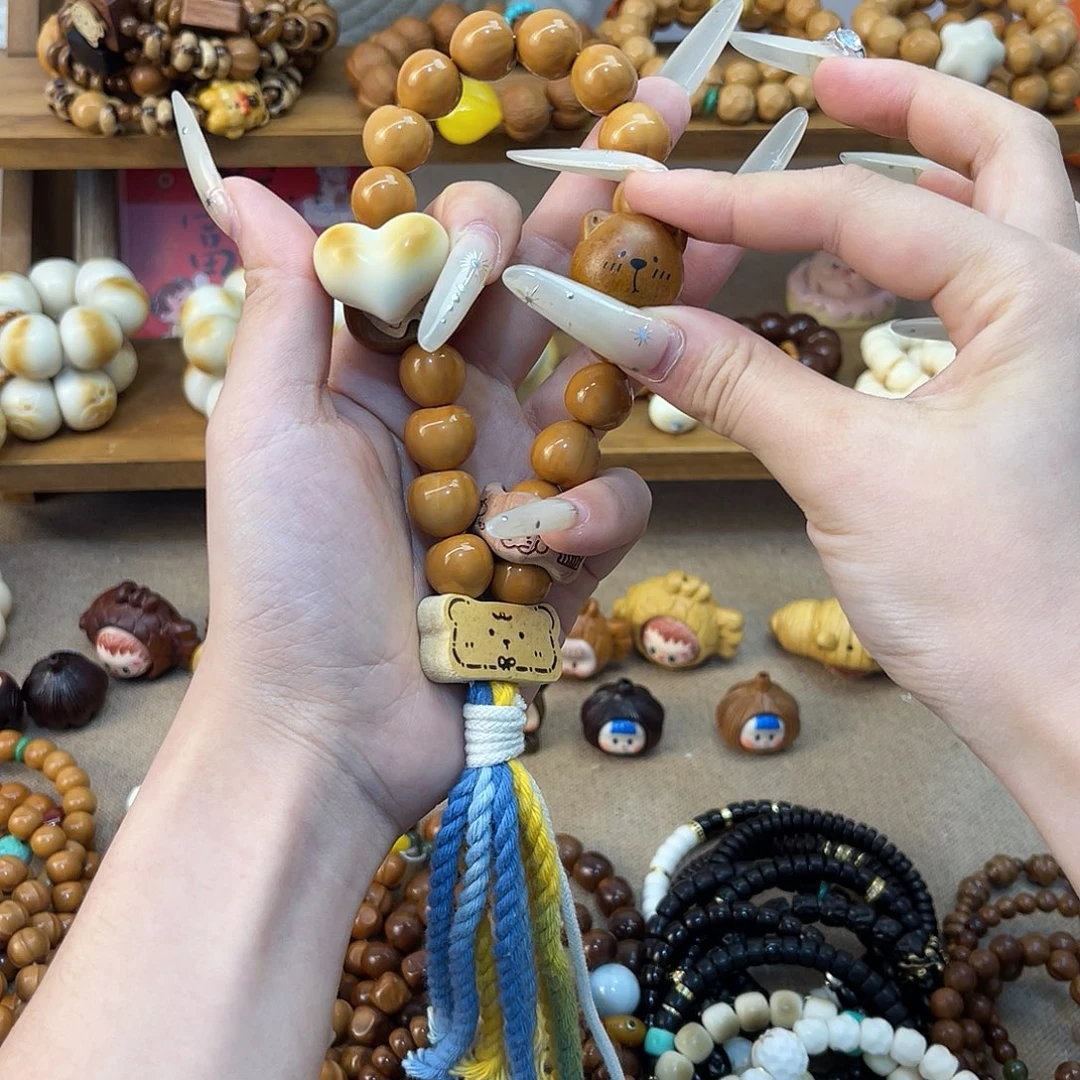 柠****猴头核桃吊坠猴头手持