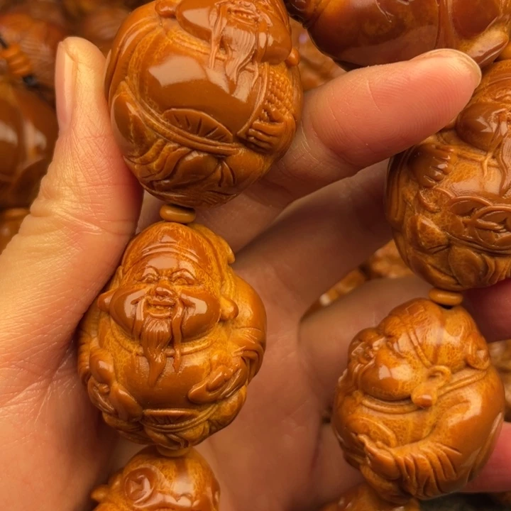 橄榄核吊坠義**辞橄榄核手持