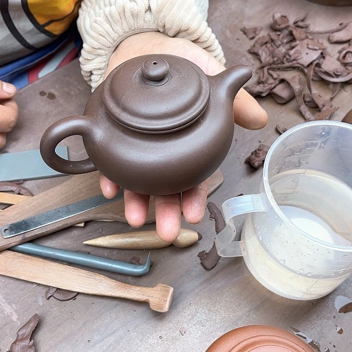 紫砂茶壶如**…瑕疵的掇只