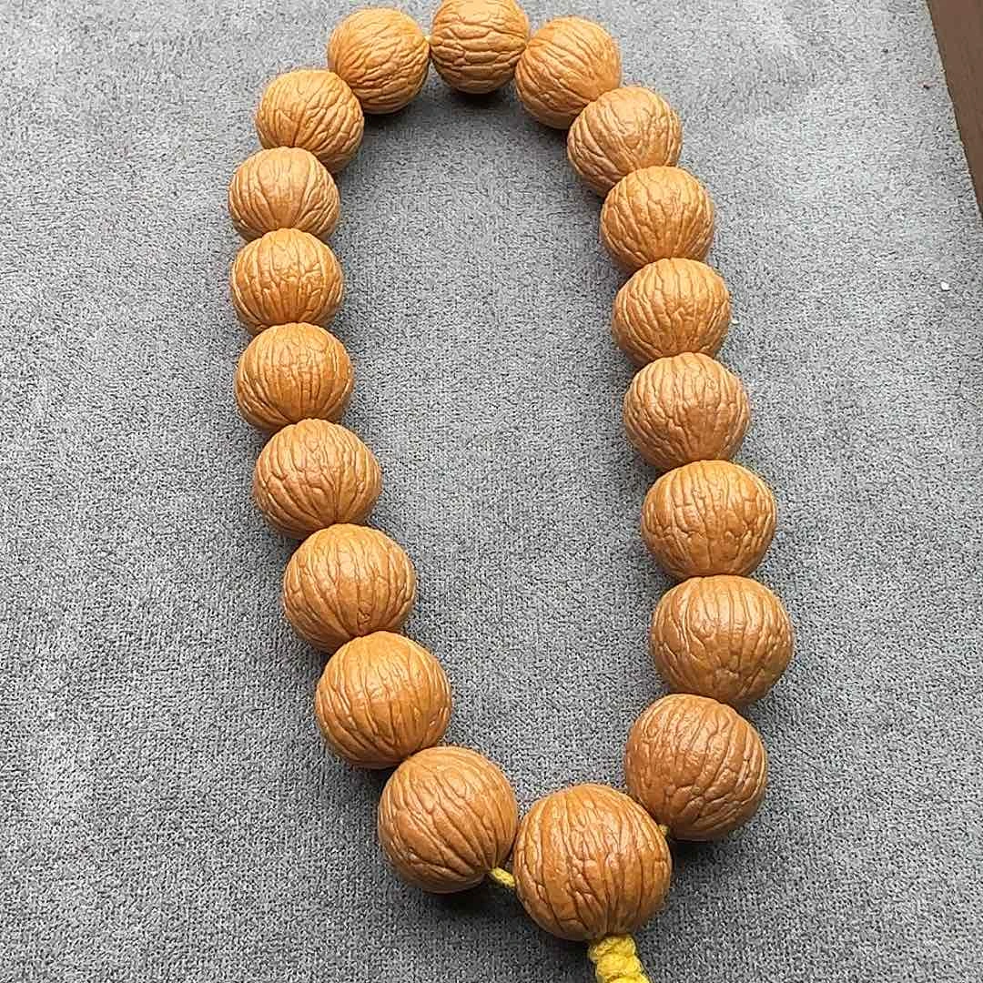 猴头核桃手串凤羽手持