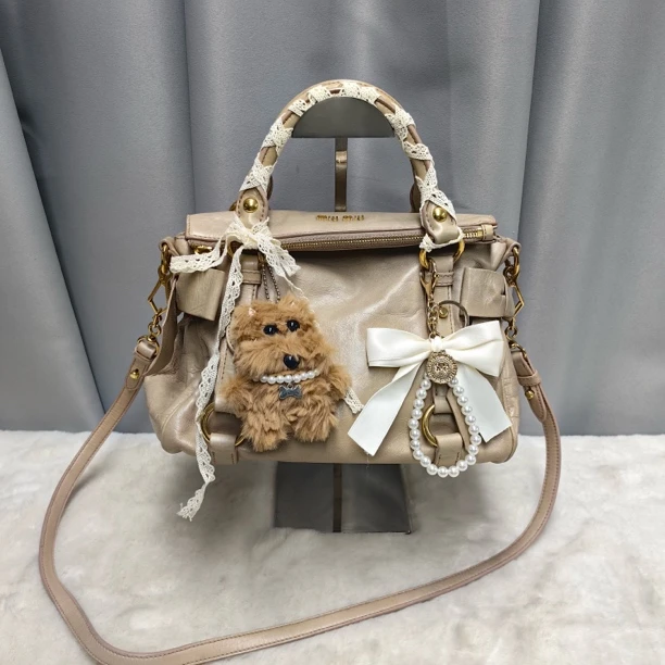 95新 MIU MIU/缪缪 蝴蝶结油蜡皮手提单肩斜挎包