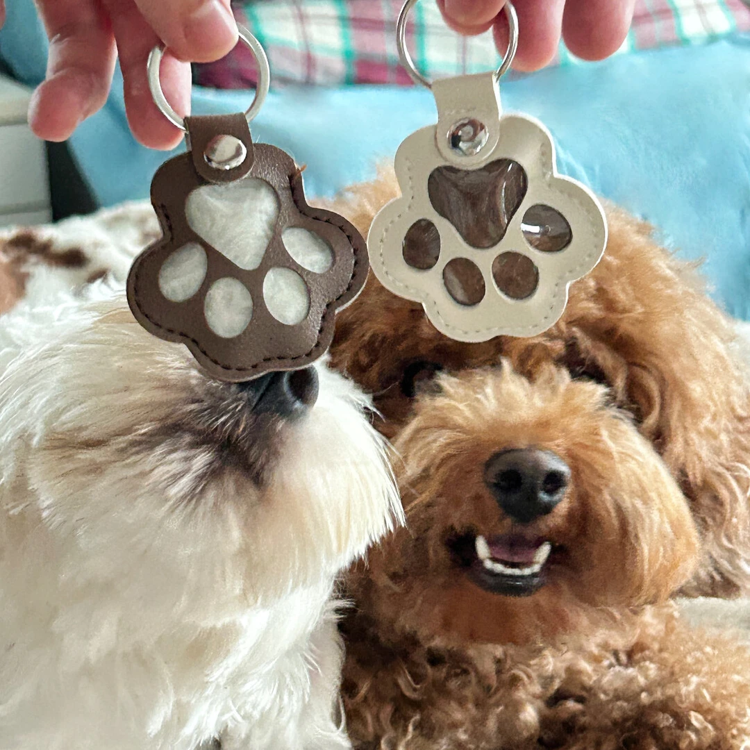 爆款皮革狗毛收纳挂件狗爪挂饰猫咪宠物毛发收纳钥匙扣包包挂件