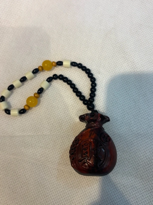 A025紫檀福袋手把件