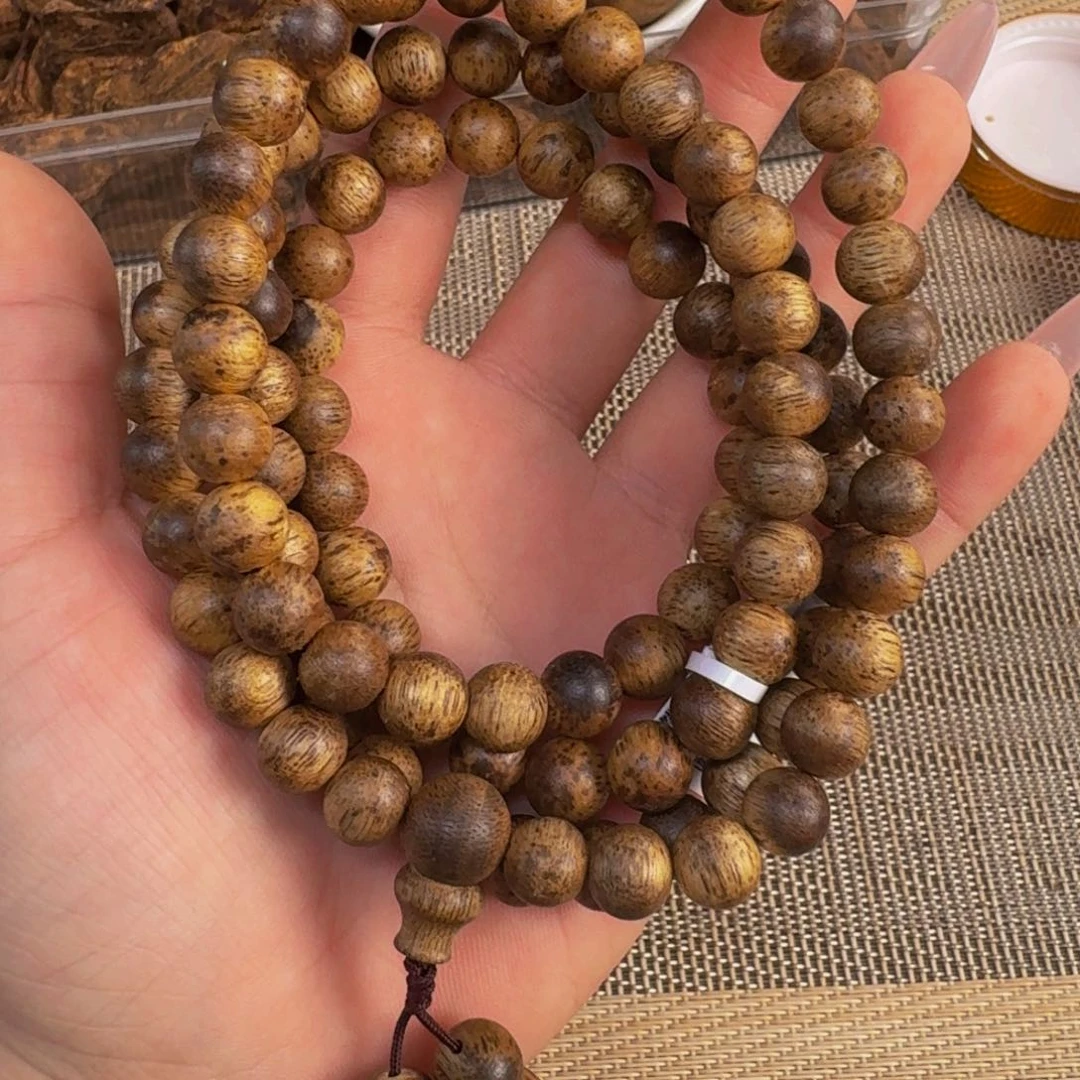 沉香吊坠解**馆天然野国香板头多圈