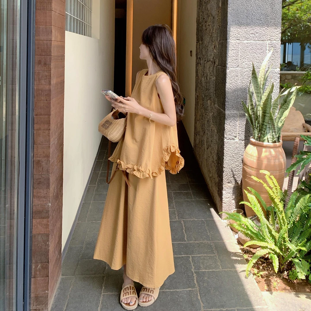 黄色气质减龄套装女2025夏季新款不规则背心高腰显瘦半身裙两件套
