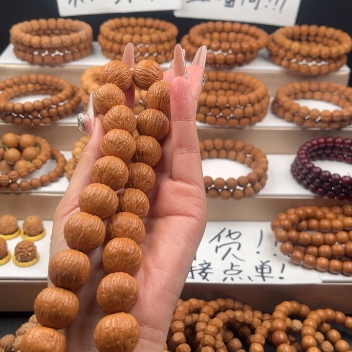 秦***二猴头核桃吊坠大凤羽手持